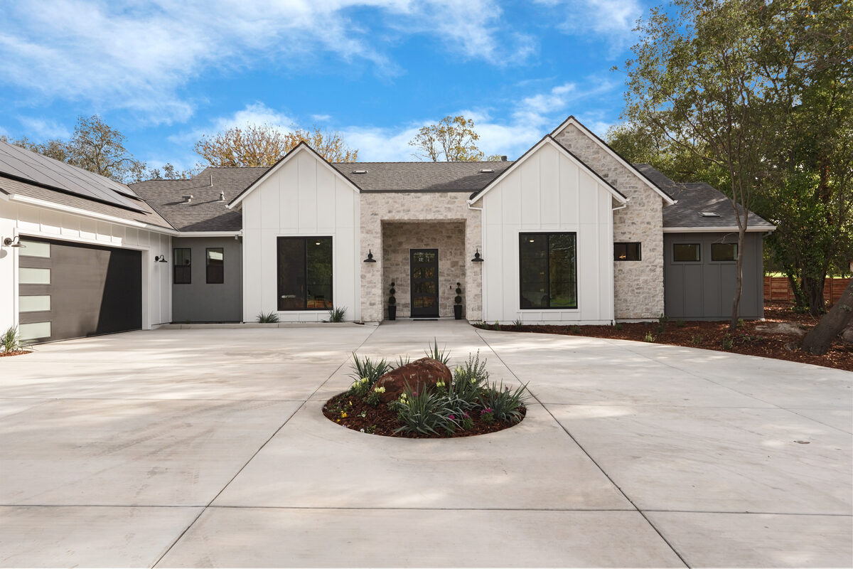 Modern farmhouse with stone accents and circular driveway in Loomis, California